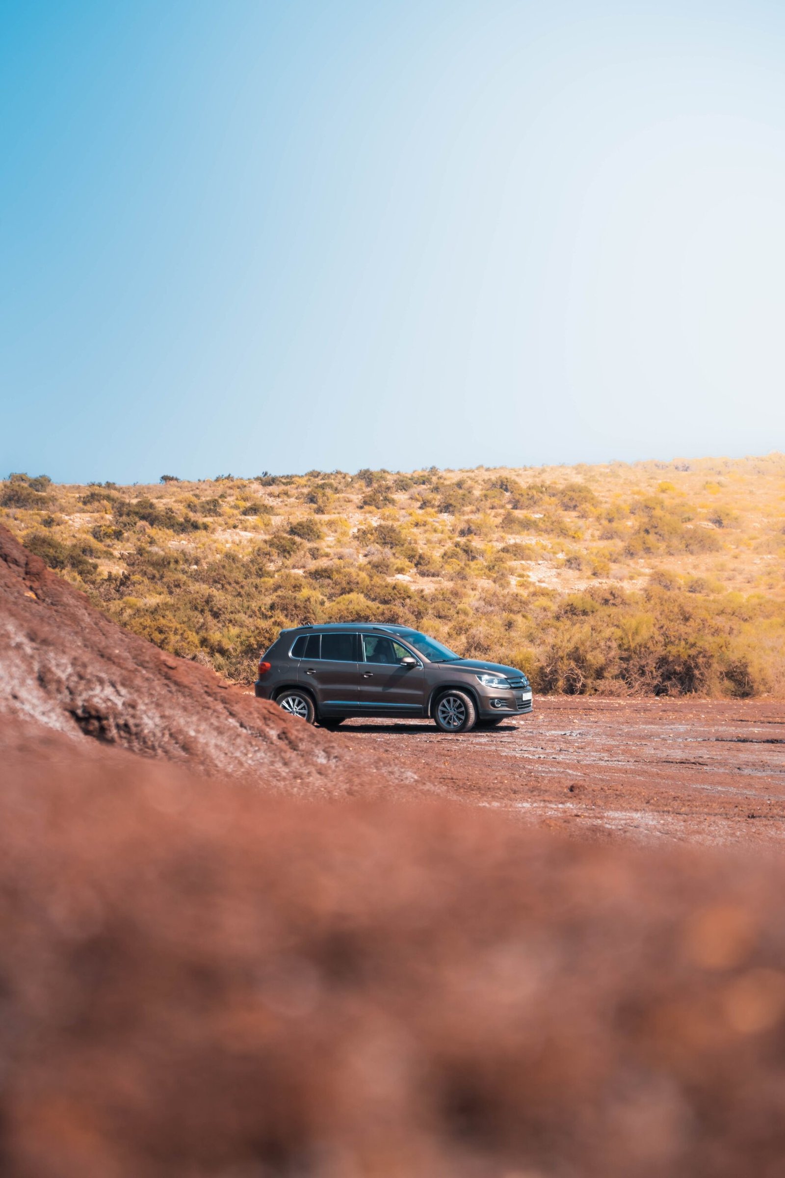 black suv on brown field during daytime